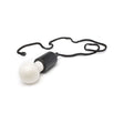 White LED bulb on black rope, battery-operated light on a rope.