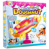 Don’t Drop The Doughnut Game box featuring colorful doughnuts and chef illustration.