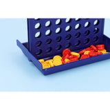 Travel size 4 in a row game with red and yellow pieces on blue background.